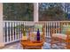 Cozy porch with wicker furniture, plants, and an outdoor rug at 2206 Weepoolow Trl, Charleston, SC 29407
