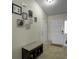 Inviting entryway with tiled floors, decorated walls, and a functional storage bench at 224 Market Hall St, Moncks Corner, SC 29461