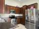 A well-equipped kitchen features stainless steel appliances, dark cabinetry, and ample counter space at 224 Market Hall St, Moncks Corner, SC 29461