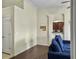 Open concept living room with kitchen view, modern floors and neutral-colored walls at 224 Market Hall St, Moncks Corner, SC 29461