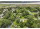 Aerial view of the house shows it nestled among trees, with water and marsh views in the distance at 2343 Herndon Dr, Charleston, SC 29414