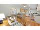 Eat-in kitchen showcasing wood cabinets, hardwood floors, stainless appliances, and an archway to living room at 2343 Herndon Dr, Charleston, SC 29414