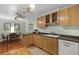 Kitchen with wood cabinets, hardwood floors, and dining area at 2343 Herndon Dr, Charleston, SC 29414
