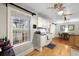 Bright kitchen with white cabinets, hardwood floors, and dining area at 2343 Herndon Dr, Charleston, SC 29414