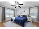 Bedroom with hardwood floors, ceiling fan, and ample natural light at 2343 Herndon Dr, Charleston, SC 29414
