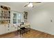 Office has built-in bookshelves, a window bench, desk, wood floors, and a light colored wall at 2343 Herndon Dr, Charleston, SC 29414