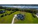 Expansive modern farmhouse with a manicured lawn and private pier overlooking the marshlands at 2621 Anchor Watch Dr, Wadmalaw Island, SC 29487