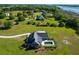 Estate aerial showcasing the home's pool, outdoor space, landscaping, and surrounding property at 2621 Anchor Watch Dr, Wadmalaw Island, SC 29487
