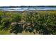 Scenic aerial shot of a waterfront with multiple docks surrounded by trees and natural marsh landscape at 2621 Anchor Watch Dr, Wadmalaw Island, SC 29487