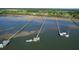 Waterfront homes with private docks nestled amongst natural beauty, showcasing waterfront living at 2621 Anchor Watch Dr, Wadmalaw Island, SC 29487