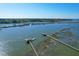 Scenic aerial shot of waterfront property with private docks and lush greenery at 2621 Anchor Watch Dr, Wadmalaw Island, SC 29487