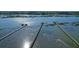 Aerial view of multiple docks extending into the water, highlighting waterfront access at 2621 Anchor Watch Dr, Wadmalaw Island, SC 29487