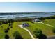 Expansive aerial view of waterfront property showcasing two homes, marsh views, and mature trees at 2621 Anchor Watch Dr, Wadmalaw Island, SC 29487