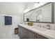 Bathroom featuring granite counters, double vanity with framed mirror and designer lighting at 2621 Anchor Watch Dr, Wadmalaw Island, SC 29487