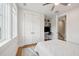 Bedroom includes an incorporated study area with built in shelving, cabinets, and a ceiling fan at 2621 Anchor Watch Dr, Wadmalaw Island, SC 29487