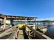 A private dock with a boat lift and water access, perfect for boating and water activities at 2621 Anchor Watch Dr, Wadmalaw Island, SC 29487