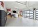 Large garage featuring epoxy floors, garage cabinets, and stairs to an upper level at 2621 Anchor Watch Dr, Wadmalaw Island, SC 29487