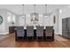 Kitchen with seating at the center island, pendant lighting, and stainless steel appliances at 2621 Anchor Watch Dr, Wadmalaw Island, SC 29487