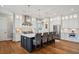 Bright kitchen features a large island with seating, modern stainless steel appliances, and beautiful hardwood floors at 2621 Anchor Watch Dr, Wadmalaw Island, SC 29487