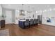 Modern kitchen featuring a large island, stainless steel appliances, and hardwood floors at 2621 Anchor Watch Dr, Wadmalaw Island, SC 29487