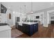 Bright kitchen with stainless steel appliances, large island and open floorplan at 2621 Anchor Watch Dr, Wadmalaw Island, SC 29487