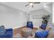 Comfortable seating area with ample seating, stylish area rug, and bright natural light at 2621 Anchor Watch Dr, Wadmalaw Island, SC 29487