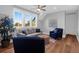 Relaxing living room filled with natural light from large windows, a comfortable sofa, and stylish decor at 2621 Anchor Watch Dr, Wadmalaw Island, SC 29487