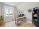 Bright office with natural light, stylish wooden desk, and hard wood floors at 2621 Anchor Watch Dr, Wadmalaw Island, SC 29487