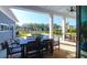 Covered outdoor patio, with a dining area and a pool visible in the backyard, perfect for entertaining at 2621 Anchor Watch Dr, Wadmalaw Island, SC 29487