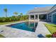 A beautiful in-ground swimming pool, surrounded by a patio and manicured backyard, perfect for outdoor enjoyment at 2621 Anchor Watch Dr, Wadmalaw Island, SC 29487
