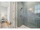 Glass enclosed shower featuring herringbone pattern tiling with modern fixtures and hardware at 2621 Anchor Watch Dr, Wadmalaw Island, SC 29487