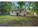 Home backyard with a wooden deck, shed, ladder, and foliage at 2702 Decatur St, North Charleston, SC 29405