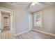 Bedroom with two windows, and a door leading into another room at 2702 Decatur St, North Charleston, SC 29405