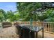 Relaxing wooden deck with comfortable seating, a table, and a scenic view at 2702 Decatur St, North Charleston, SC 29405
