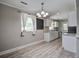 Bright dining area with updated finishes, including hardwood floors and fixtures at 2702 Decatur St, North Charleston, SC 29405
