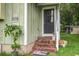 Inviting home entrance with brick steps and landscaping at 2702 Decatur St, North Charleston, SC 29405