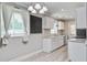 Bright kitchen featuring white cabinets, stainless appliances, granite countertops and light wood flooring at 2702 Decatur St, North Charleston, SC 29405