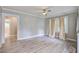 Bright living room with large windows, light LVP flooring, and neutral paint at 2702 Decatur St, North Charleston, SC 29405