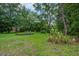 The large lawn features a mulched flower bed and sapling trees at 2903 Shadow Ln, North Charleston, SC 29406