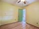 This bedroom features hardwood floors, a ceiling fan, and closet access at 2903 Shadow Ln, North Charleston, SC 29406