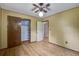 This bedroom features paneled walls, a ceiling fan, and a closet with built in shelving at 2903 Shadow Ln, North Charleston, SC 29406