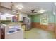 Vintage style kitchen with stainless steel refrigerator and view to the backyard at 2903 Shadow Ln, North Charleston, SC 29406