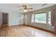 Inviting living room with hardwood floors, a ceiling fan, and large windows for natural light at 2903 Shadow Ln, North Charleston, SC 29406