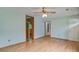 Spacious living room with multiple doorways and hardwood floors provides ample space at 2903 Shadow Ln, North Charleston, SC 29406
