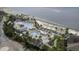 Aerial view of beach resort with swimming pools, beach access, and lush palms at 2942 Atrium Villa Dr # 42, Johns Island, SC 29455