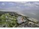 Stunning aerial view of coastal resort featuring golf course, beach, and ocean views at 2942 Atrium Villa Dr # 42, Johns Island, SC 29455