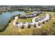 Scenic aerial view of the community clubhouse, lake, and surrounding landscaped grounds at 2942 Atrium Villa Dr # 42, Johns Island, SC 29455