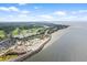 Breathtaking aerial of coastal community including golf, beach, pool, and dining at 2942 Atrium Villa Dr # 42, Johns Island, SC 29455