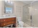 Bright bathroom featuring a glass enclosed shower, and classic vanity with marble countertop, complementing the neutral color palette at 2942 Atrium Villa Dr # 42, Johns Island, SC 29455