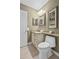 Well-lit bathroom featuring vanity with granite counters, modern fixtures and a separate toilet area; maximizes space at 2942 Atrium Villa Dr # 42, Johns Island, SC 29455